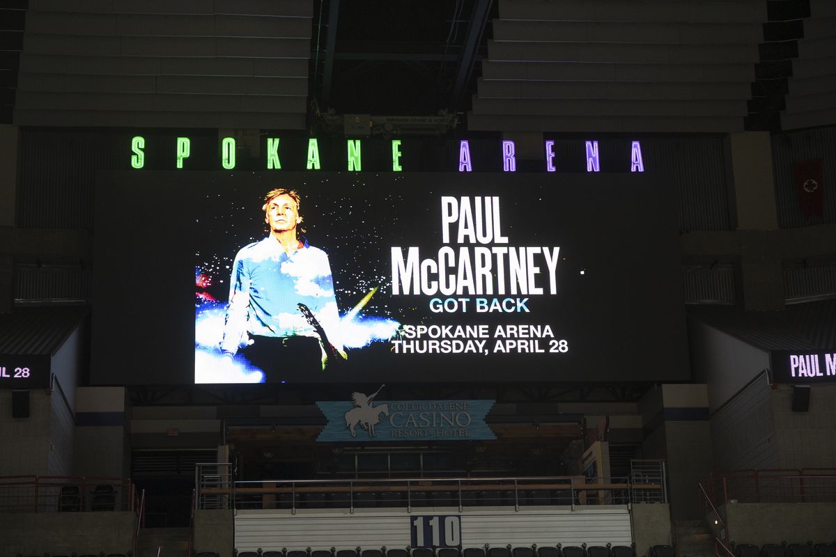 The video screen on the wall of the Spokane Arena shows a graphic of Paul McCartney after an official announced a April 28 concert of former Beatle Paul McCartney on live television Friday, Feb. 18, 2022.  (Jesse Tinsley/The Spokesman-Revi)