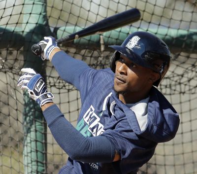 Seattle Mariners’ Jarrod Dyson bats during spring training. (Charlie Riedel / Associated Press)