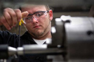 
Patrick Berner gets practice using a lathe in Spokane Community College's machine shop during a class for the Institute for Extended Learning's iBest program. Berner is also working toward his GED through iBest, which combines basic education with college-level technical education in high-demand fields. 
 (Holly Pickett / The Spokesman-Review)