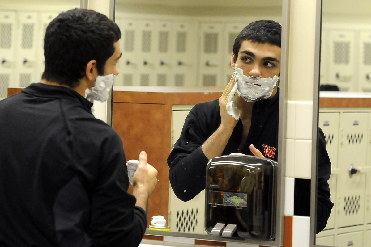 West Valley High School wrestler Devan Silva complies with the referee's instructions to shave before his match with Pullman's Matt Lyon on Tuesday, Jan. 26, 2010, at West Valley. (Dan Pelle / The Spokesman-Review)