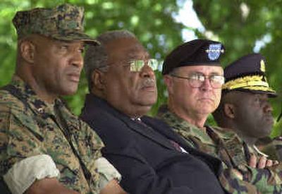 
From left, U.S. Marine Brig. Gen. Ronald Coleman, Haiti's interim Prime Minister Gerard Latortue, Army Gen. James T. Hill, commander of U.S Southern Command, and Police Director of Haiti Leon Charles attend the handover ceremony Friday in Port-au-Prince, Haiti.
 (Associated Press / The Spokesman-Review)