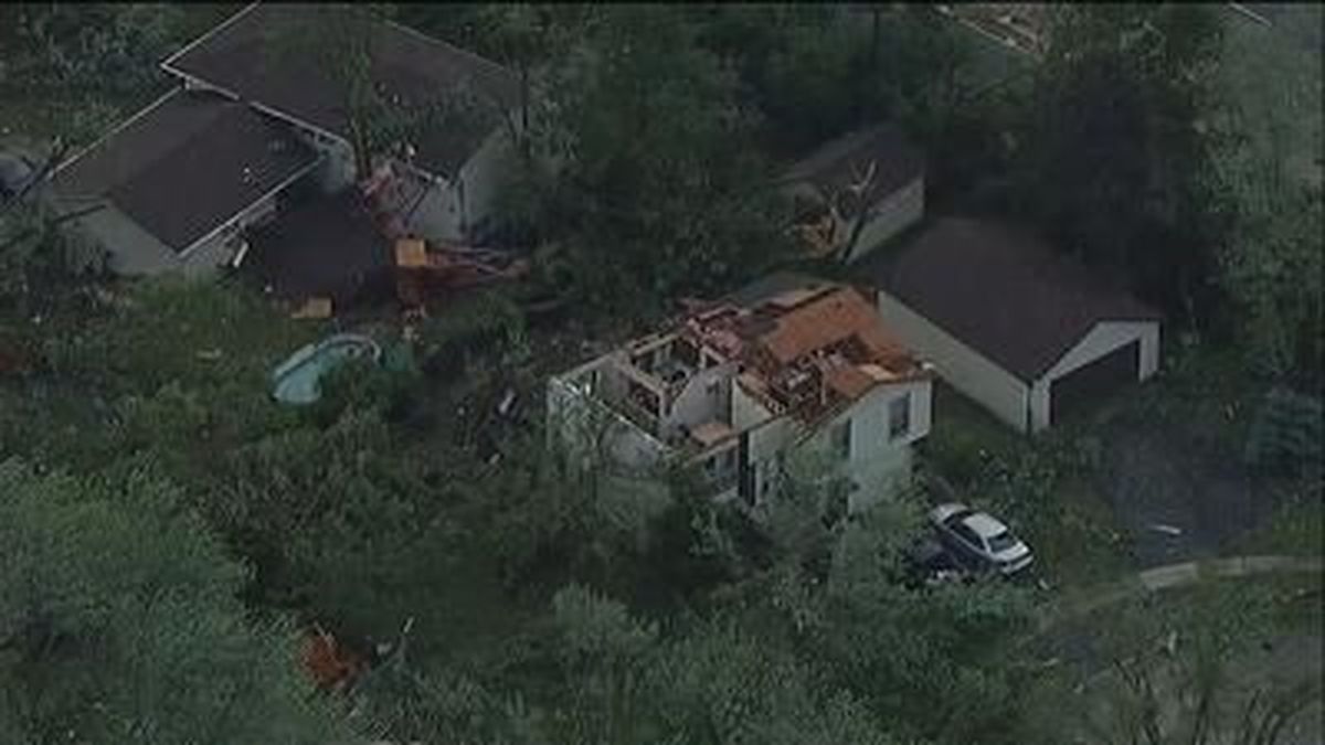 A tornado has damaged more than 100 homes and injured at least five people in suburban Chicago. The storm struck several densely populated communities after dark Sunday night. 