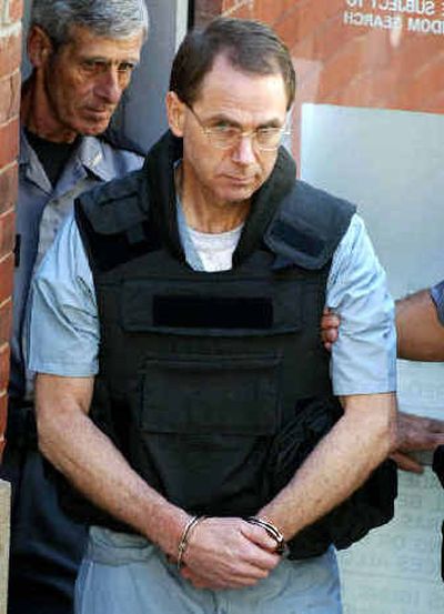 
Convicted Oklahoma City bombing conspirator Terry Nichols is led away from the county courthouse in McAlester, Okla., on Monday. 
 (Associated Press / The Spokesman-Review)