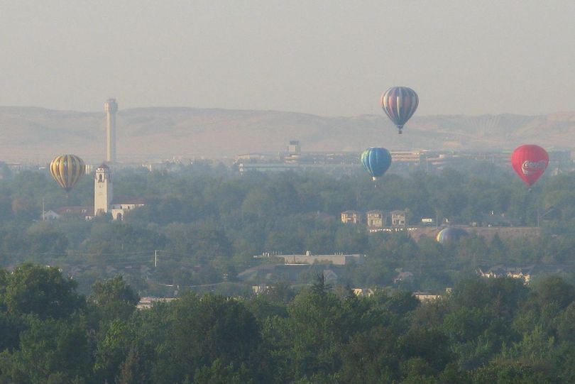 Hot-air balloons over Ann Morrison Park in Boise, as part of the 22nd Spirit of Boise Balloon Classic on Friday morning. The balloon launches will continue each morning through the weekend. (Betsy Russell)