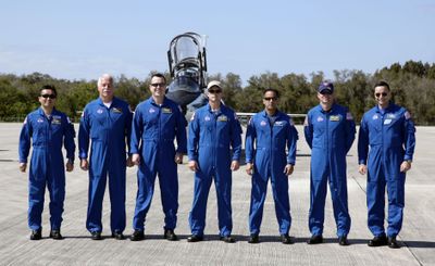 Discovery team,  from left, Japanese Space Agency astronaut Koichi Wakata, mission specialists John Phillips, Richard Arnold, Steven Swanson and Joseph Acaba, pilot Tony Antonelli and commander Lee Archambault at Kennedy Space Center  on Sunday.  (Associated Press / The Spokesman-Review)