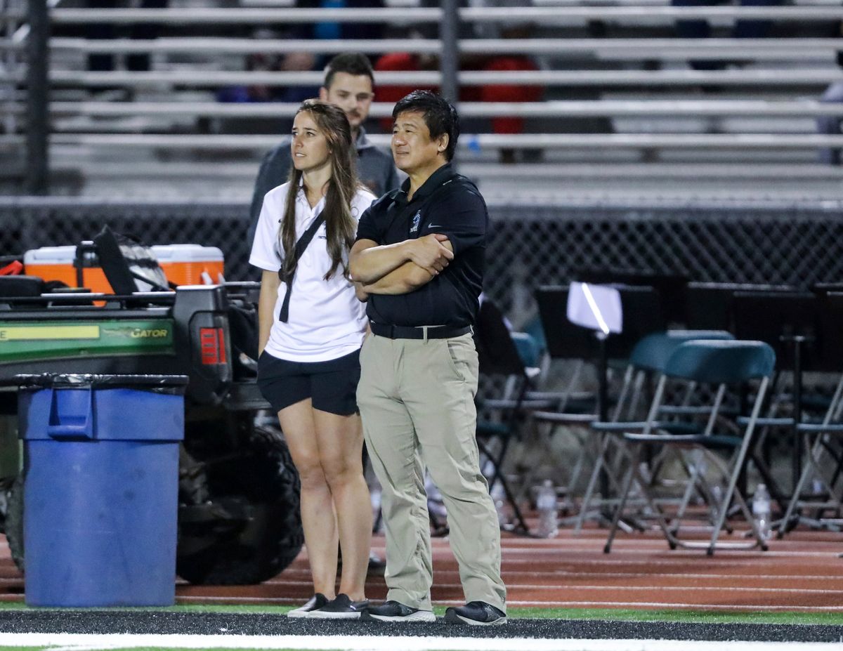 Dr. John Cheng stands on the sidelines as the Aliso Niguel High School team doctor.  (Andrew Mashburn)