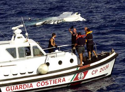 
The downed plane's wreckage is seen Saturday as rescuers stand on a Coast Guard boat in the waters off Palermo, on the Sicilian coast, southern Italy.
 (Associated Press / The Spokesman-Review)