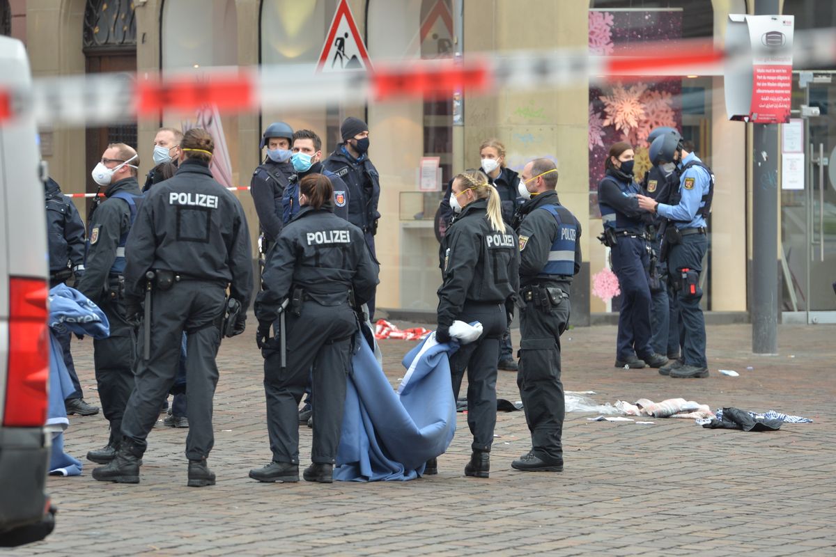 A street is blocked by the police in Trier, Germany, Tuesday, Dec. 1, 2020. German police say people have been killed and several others injured in the southwestern German city of Trier when a car drove into a pedestrian zone. Trier police tweeted that the driver had been arrested and the vehicle impounded. (Harald Tittel)