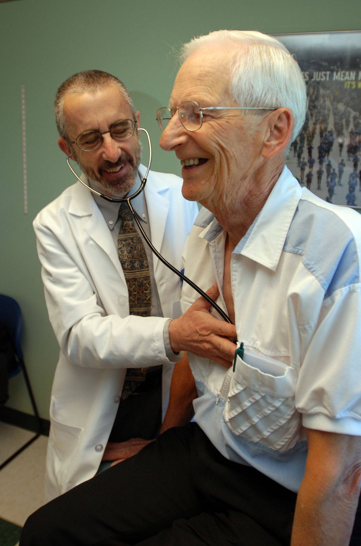 In this June 19, 2012 photo, Dr. Bruce Stowell examines patient Robert Busch at his office in Grants Pass, Ore. Stowell is among many doctors in rural areas who have capped the numbers of Medicare patients they take due to low reimbursement levels. A nationwide shortage of primary care physicians willing to set up practice in rural areas is making the problem worse. (Jeff Barnard / Associated Press)