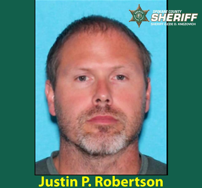 Police are searching for a Justin P. Robertson, 42, who is accused of stabbing his wife and kidnapping his 6-year-old son from a Spokane Valley home. (Spokane County Sheriff’s Office)