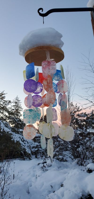 Snow and ice bog down a wind chime in Palouse during the first week of December.  (Linda Weiford)