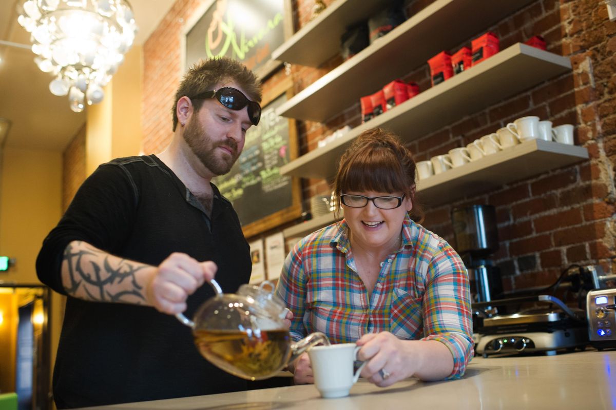 Savannah Breeden and Thomas Kilborn pour a cup of tea on March 7 at their new shop, Urban Nirvana in downtown Spokane. (Tyler Tjomsland / The Spokesman-Review)