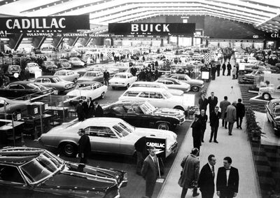 This Jan. 16, 1969, file photo shows exhibitors at the Brussels Car Show held at the Plais Du Centenaire, in Belgium. General Motors survived wars, strikes and the Great Depression churning out Chevys, Cadillacs and other vehicles that often defined their owners’ status in life. But less than a year into its second 100 years, it’s coming to the end of a road, ushered by the government into bankruptcy protection.  (File Associated Press / The Spokesman-Review)