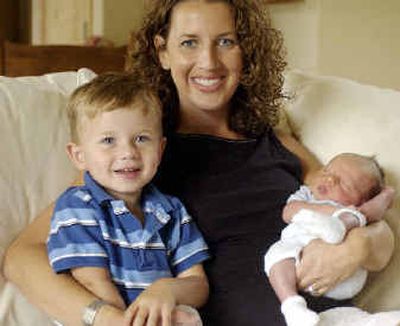 Ronni Collins, with sons, Bailey, 2, and Carter, who was born Aug. 5, was diagnosed with leukemia at age 3. She endured chemotherapy and spinal taps. Doctors then gave patients a 50-50 chance of beating cancer and living a normal lifespan.
(Kathryn Stevens / The Spokesman-Review)