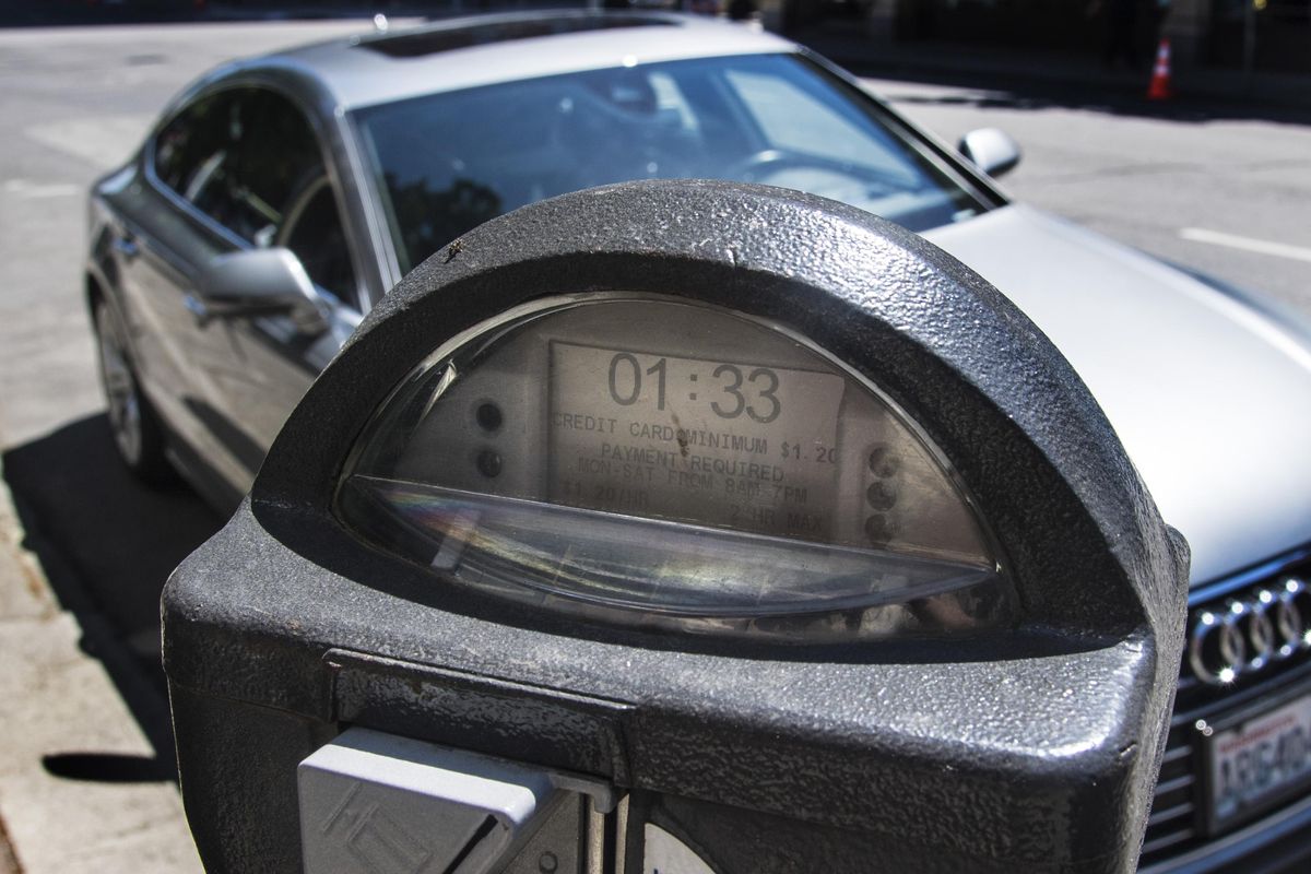 Time on a downtown Spokane parking meter  ticks down for an Audi parked on Sprague Avenue. (Dan Pelle / The Spokesman-Review)