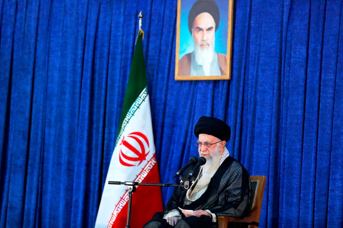 In this photo released by an official website of the office of the Iranian supreme leader, Supreme Leader Ayatollah Ali Khamenei speaks on the anniversary of the death of the late founder of the Islamic Republic, Ayatollah Ruhollah Khomeini, shown in the poster at top center, at his mausoleum in Tehran, Iran, Saturday, June 4, 2022. Khamenei acknowledged Saturday that Iran took the oil from two Greek tankers last month in helicopter-launched raids in the Persian Gulf.  (HOGP)