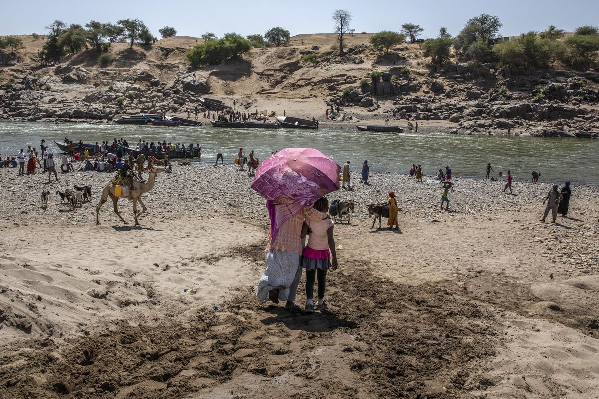In this Nov. 21, 2020 photo, refugees who fled the conflict in Ethiopia
