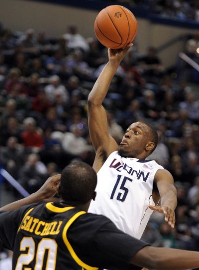 Connecticut's Kemba Walker had 24 points, 13 rebounds and 10 assists in victory. (Associated Press)