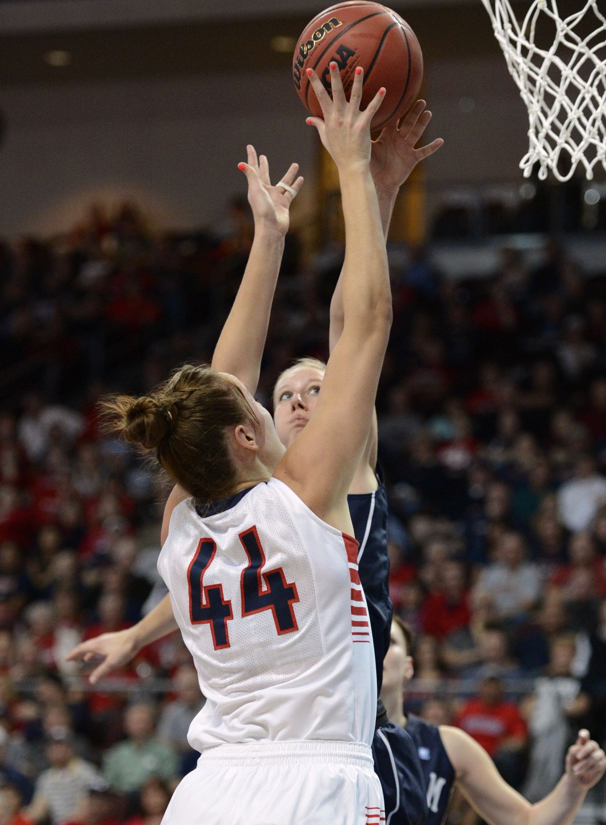 GU’s Shelby Cheslek (44) scores on her way to tying her season high of 16 points. (Colin Mulvany)