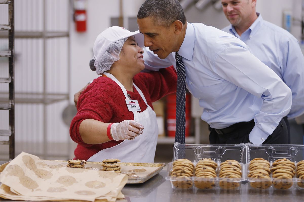 President Barack Obama greets an employee in the bakery at a Costco store in Lanham, Md. (Associated Press)