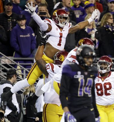 Southern California’s Darreus Rogers (1) celebrates his touchdown against Washington in the first half of Saturday’s game in Seattle. (Elaine Thompson / Associated Press)