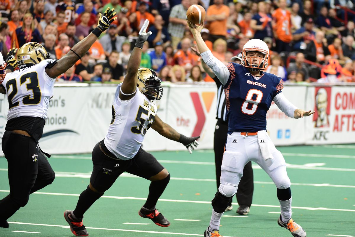 Shock quarterback Warren Smith, who had six touchdown passes, throws against the Outlaws on Friday night at the Arena. (Tyler Tjomsland)
