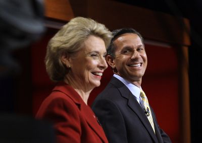 Gov. Chris Gregoire and Dino Rossi wait for the start of their debate Saturday.  (Associated Press / The Spokesman-Review)