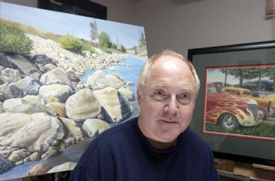 
Craig Shillam is shown in his studio with a recent unfinished  oil painting depicting the Spokane River in the summer, and, 
