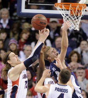 Gonzaga's Kelly Olynyk (13) taps away rebound during the first half of their men's college basketball game, Thursday, Jan. 24, 2013, in the McCarthey Athletic Center. (Colin Mulvany / The Spokesman-Review)