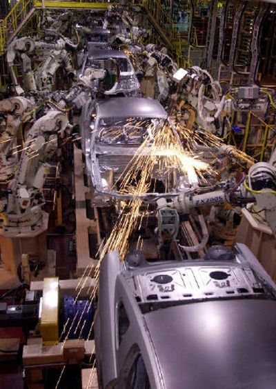 
Assemblyline robots weld the 2005 Ford Mustang at the AutoAlliance International plant in Flat Rock, Mich. For companies that buy steel for everything from auto parts to appliances, it's meant pain.
 (Associated Press / The Spokesman-Review)