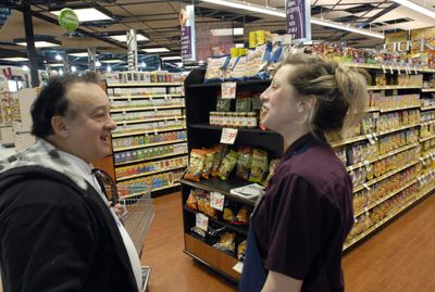 Longtime Rosauers customer Louie Miacolo talks with Huckleberries manager, Amy Lindsey, about the selection of natural and organic foods that are available.  (J. BART RAYNIAK / The Spokesman-Review)