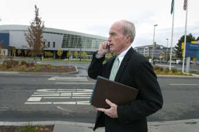 
Mayor Dennis Hession takes a call as he walks  from City Hall to the Doubletree Hotel to meet with a group touring the Spokane area Sept. 20. 
 (Dan Pelle / The Spokesman-Review)