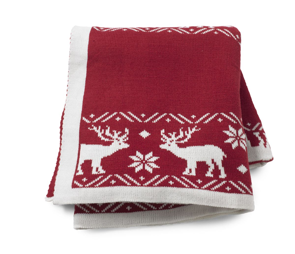 This photo from HomeGoods.com shows Reindeer and snowflakes adorning a cranberry and white throw, perfect for winter nights. (Associated Press)