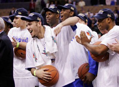 
UCLA's Jordan Farmar, second from left, celebrates the Pac-10 Conference tournament title with his Bruins teammates Saturday. 
 (Associated Press / The Spokesman-Review)