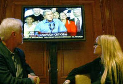 Former Fox News employees David Korb, left, and Clara Frenk watch clips from Robert Greenwald's documentary,