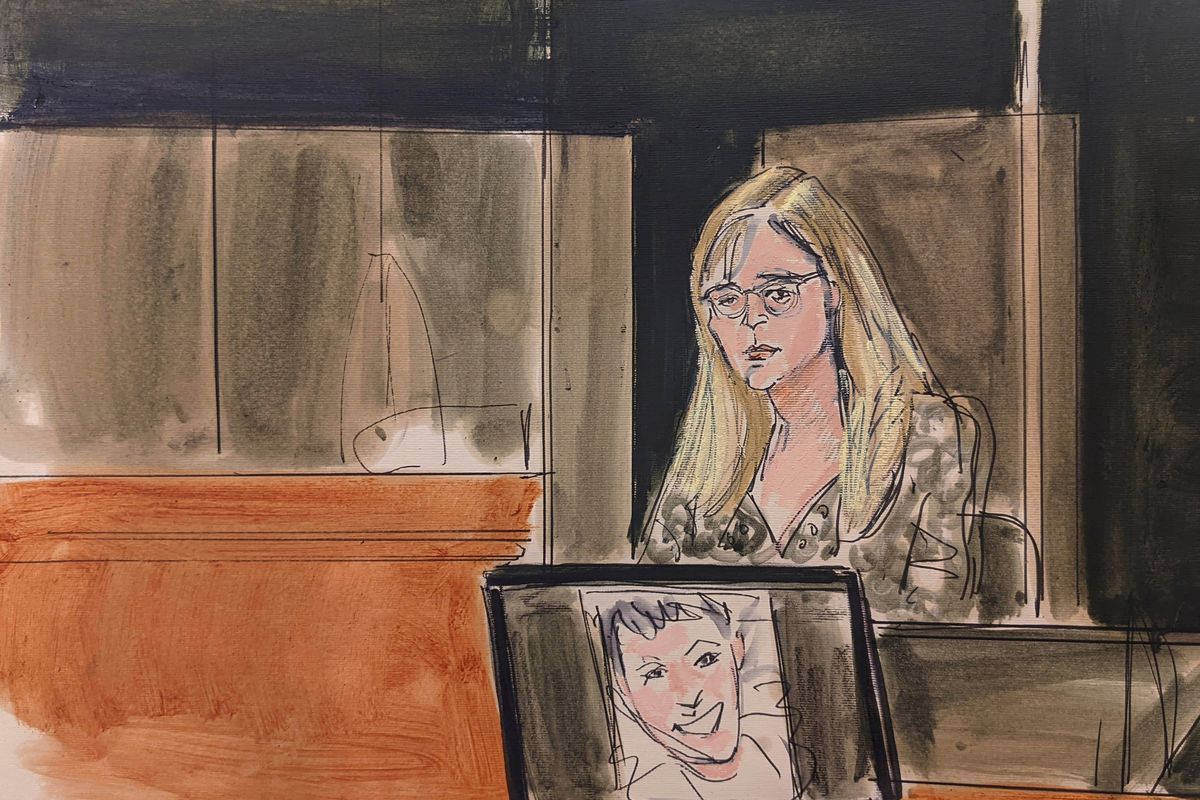 In this courtroom sketch, Annie Farmer testifies on the witness stand during the Ghislaine Maxwell sex abuse trial, Friday, Dec. 10, 2021, in New York. A photo of Maxwell appears on a screen at foreground.  (Elizabeth Williams)