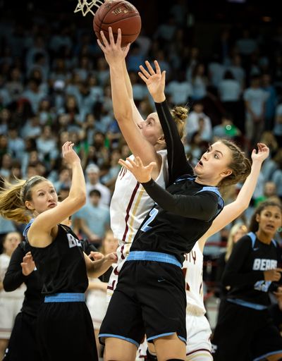 University guard Ellie Boni (5) heads to the basket as Central Valley forward Kate Sams (2) defends during the Stinky Sneaker high school basketball game at the Spokane Veterans Arena, Wed., Jan. 16, 2019. (Colin Mulvany / The Spokesman-Review)