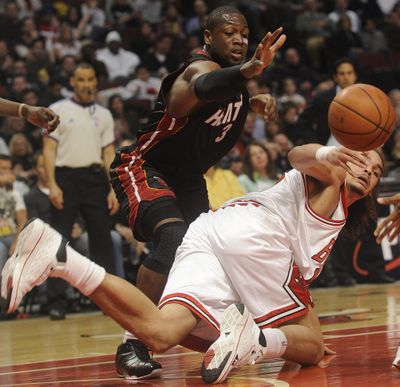 Miami’s Dwyane Wade (3) hustled his way to 24 points against Chicago.  (Associated Press / The Spokesman-Review)