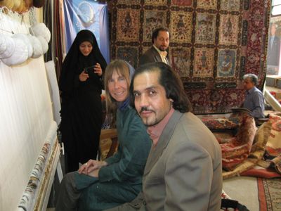 Local author Meghan Nuttall Sayres is seated at the loom of Iran’s World Peace Carpet with head weaver Jafar Shahabi and Fahimeh Naderinajad, the Saad Abad Cultural Center Museum curator. Courtesy of Meghan Nuttall Sayre (Courtesy of Meghan Nuttall Sayre / The Spokesman-Review)