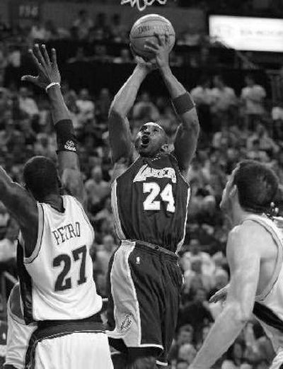 
Johan Petro, Nick Collison, right, and the Seattle SuperSonics had trouble controlling the Lakers' Kobe Bryant, who scored 46 points Friday. 
 (Associated Press / The Spokesman-Review)