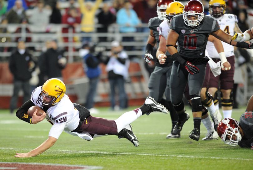 Arizona State quarterback Taylor Kelley (10) dives with the ball for a touchdown against Washington State during the first half of a college football game on Thursday, October 31, 2013, at Martin Stadium in Pullman, Wash. (Tyler Tjomsland / The Spokesman-Review)