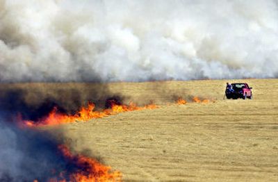 
 A fire is ingited in a field of Kentucky bluegrass in 2002 on the Rathdrum Prairie.  The Idaho Supreme Court on Wednesday upheld a determination that 