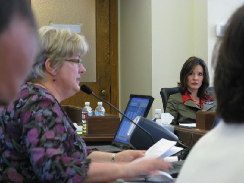 Legislative budget director Cathy Holland-Smith addresses JFAC on Tuesday. At right is Rep. Janice McGeachin, R-Idaho Falls. (Betsy Russell / The Spokesman-Review)