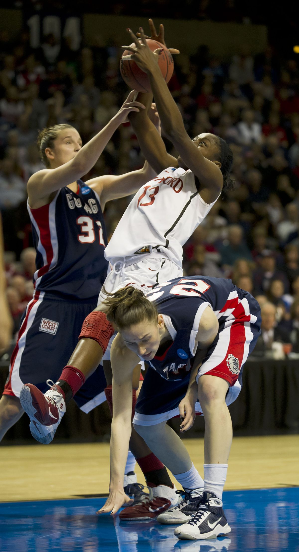 Kayla Standish, left, and Katelan Redmon clobber Stanford’s Chiney Ogwumike. (Colin Mulvany)