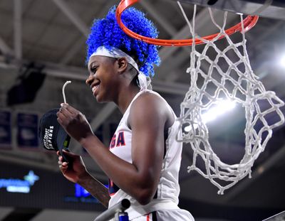 Gonzaga forward Zykera Rice  grins as she cuts down the net following  Saturday’s Senior Day win over Loyola Marymount  at McCarthey Athletic Center. Gonzaga won 68-58. (Tyler Tjomsland / The Spokesman-Review)