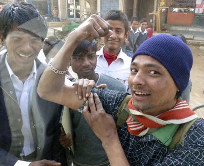 The smiles of strangers, such as these boys in India, can brighten a traveler's day. (Dan Webster)