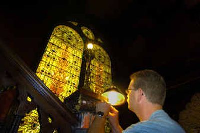 
Dan Heitt, a carpenter with Walker Construction, rebuilds a bannister post for the main stairway of the Patsy Clark Mansion on West Second in Spokane on Tuesday. 
 (Christopher Anderson/ / The Spokesman-Review)