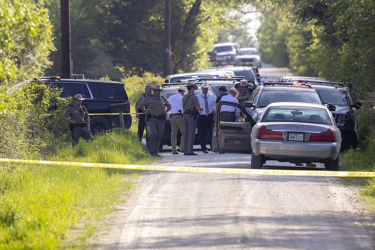 First responders work at the scene of the apprehension of a suspect at a residence in Bedias, Texas, Thursday, April 8, 2021, following a shooting at Kent Moore Cabinets in Bryan, Texas. One person was killed and several people were wounded Thursday in the wake of a shooting at the cabinet-making business in Bryan, authorities said, and a state trooper was later shot during a manhunt that resulted in the suspected shooter being taken into custody.  (Michael Miller)