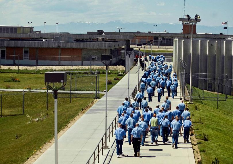 Inmates walk from their cellblock to the dining hall at the Idaho State Correctional Institution south of Boise. (Charlie Litchfield / File/Associated Press)