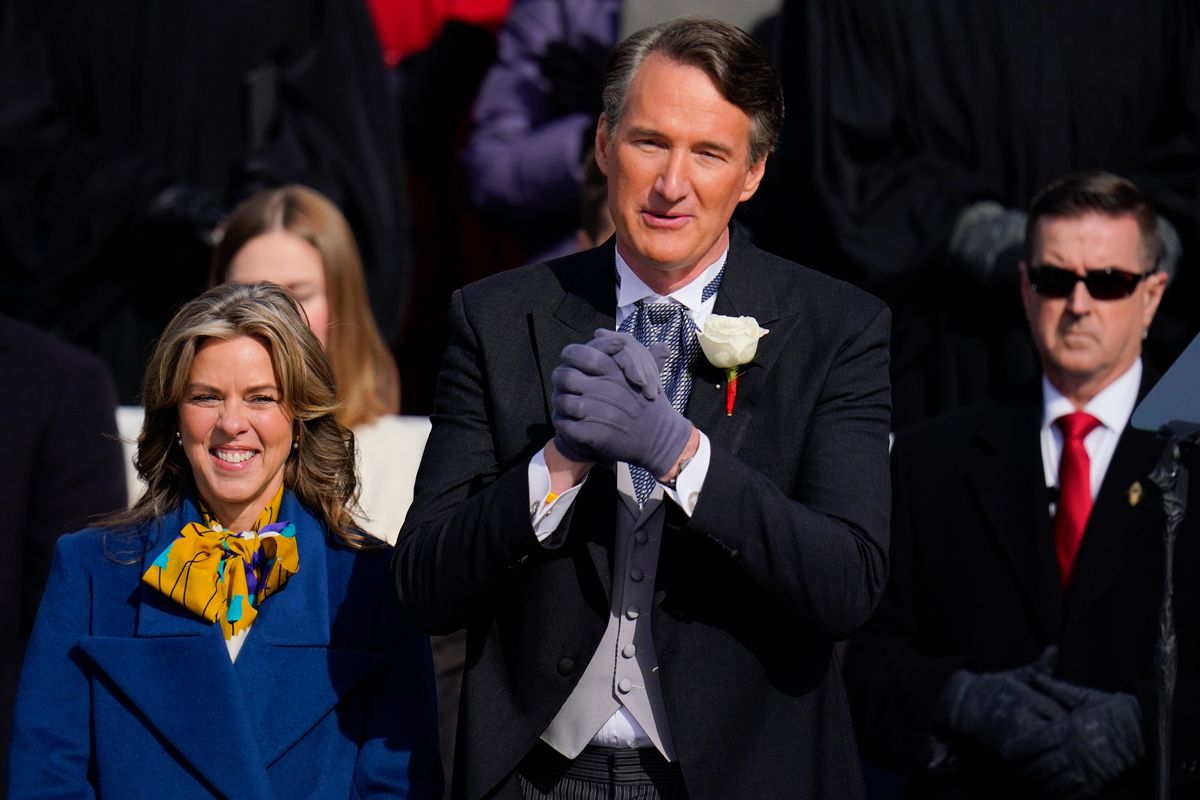 Gov. elect Glenn Youngkin with wife Suzanne Youngkin wave to the crowd before his inauguration ceremony, Saturday, Jan. 15, 2022, in Richmond, Va.  (Julio Cortez)